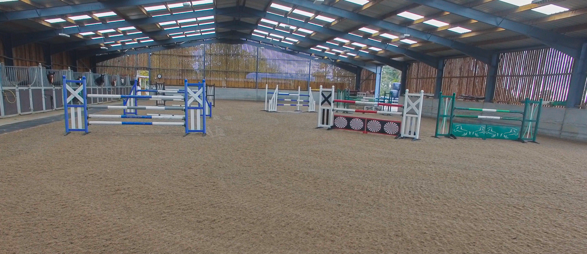 Equestrian arena with hurdles