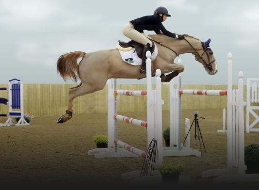 Combi-Pro with horse jumping over hurdles