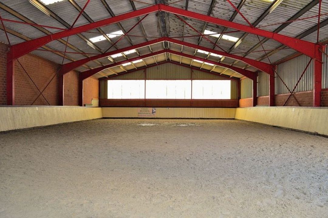Horse arena with red roof